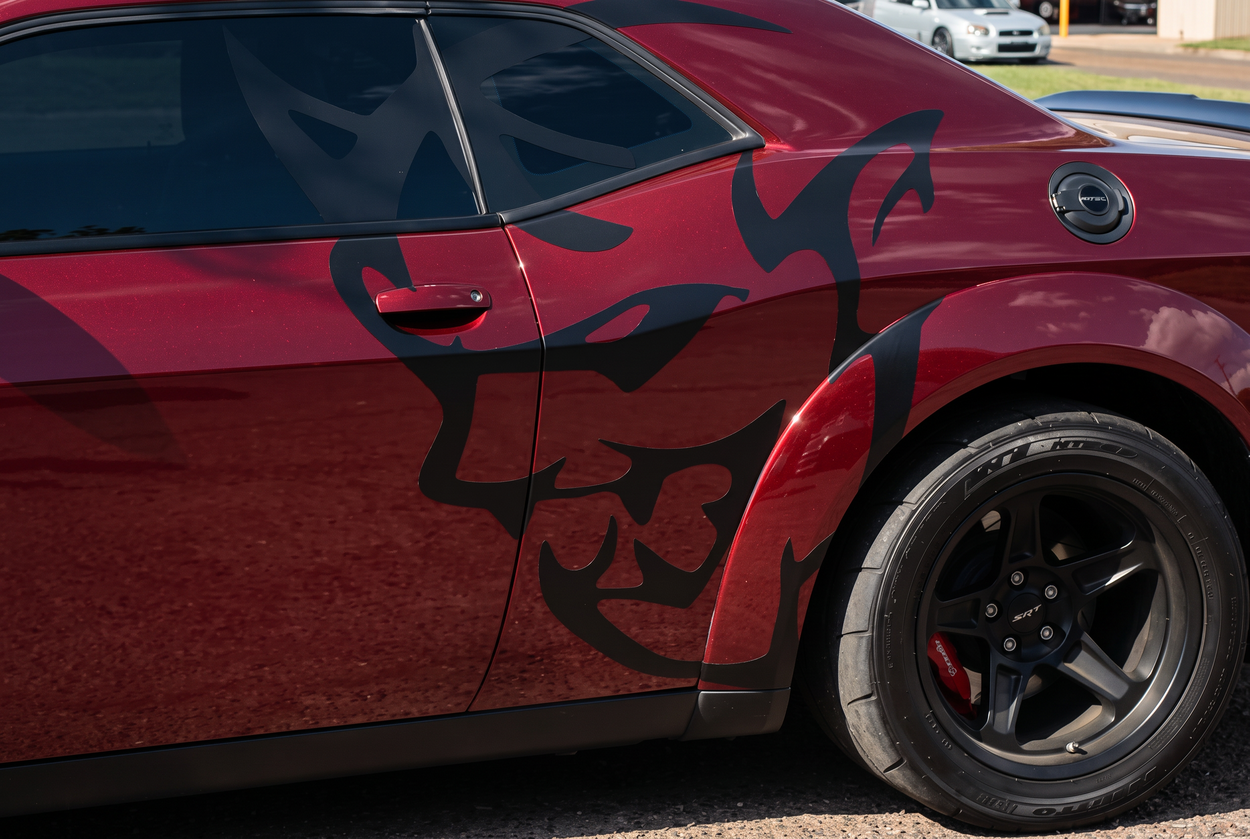 Black fox decal installed on a red car